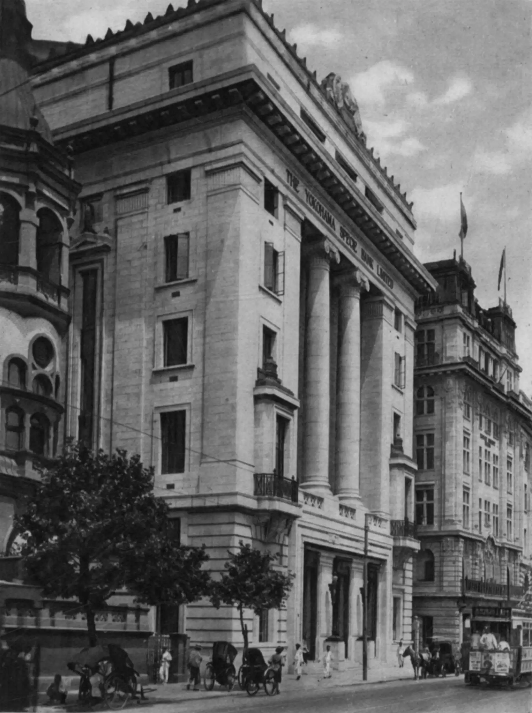 The Yokohama Specie Bank building on the Bund, a stone bank with a columned front, in a plate from the 1927 book Shanghai of Today.