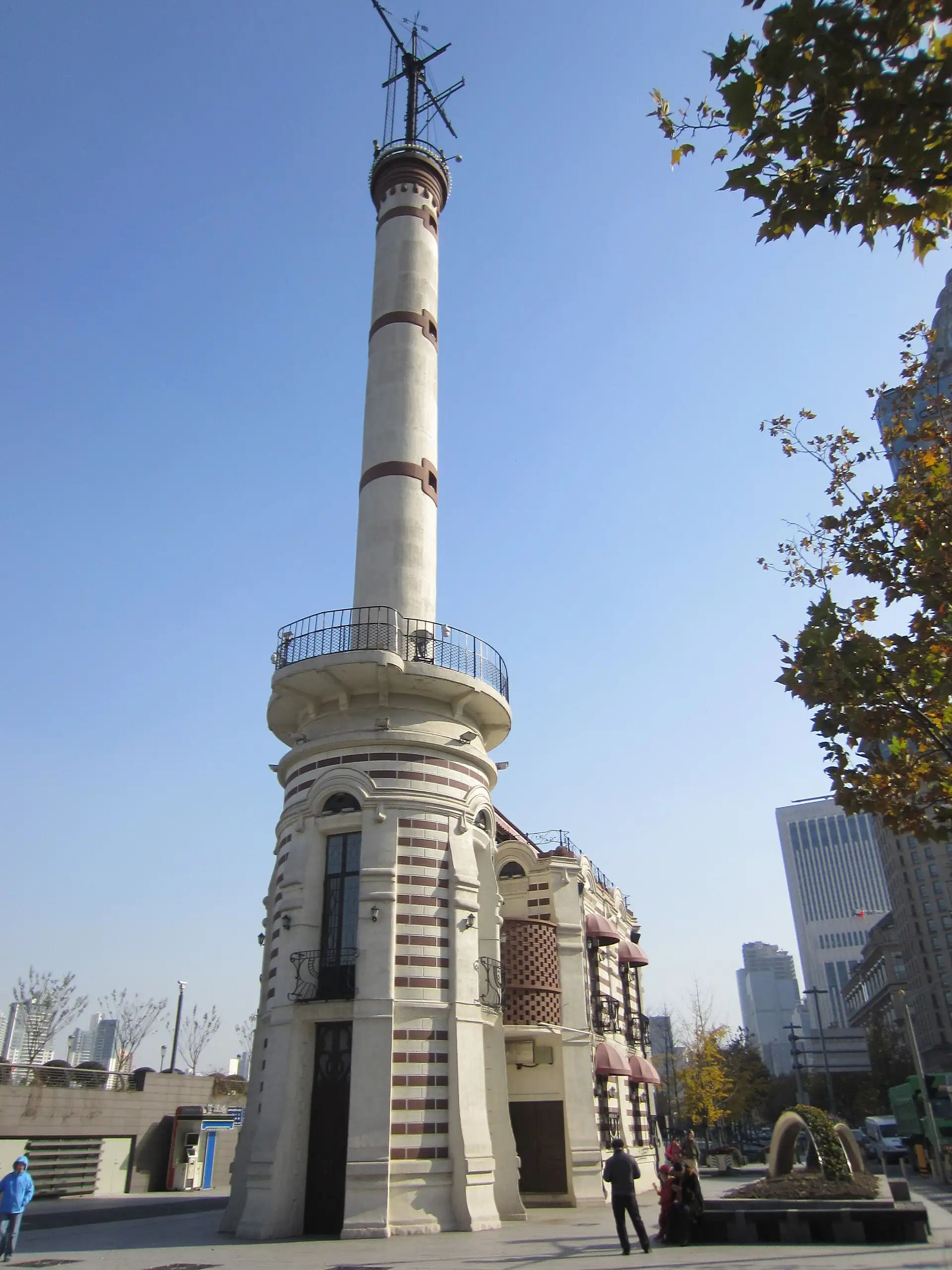 The Gutzlaff Signal Tower, a slender striped tower on the Bund waterfront.