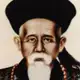 Colour portrait painting of an elderly man with a white beard, wearing a black Qing official hat with a red button and a beaded necklace.